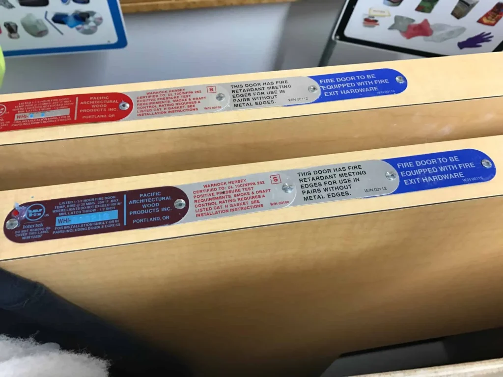 Fire rated wooden door label edge