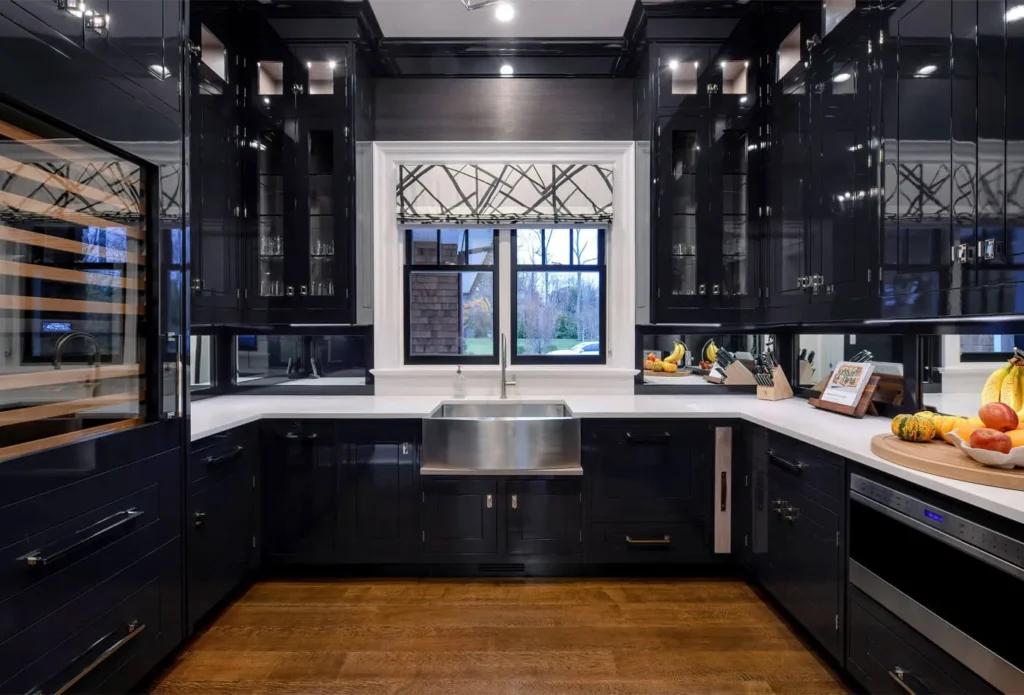 Black kitchen cabinets white walls bright natural light