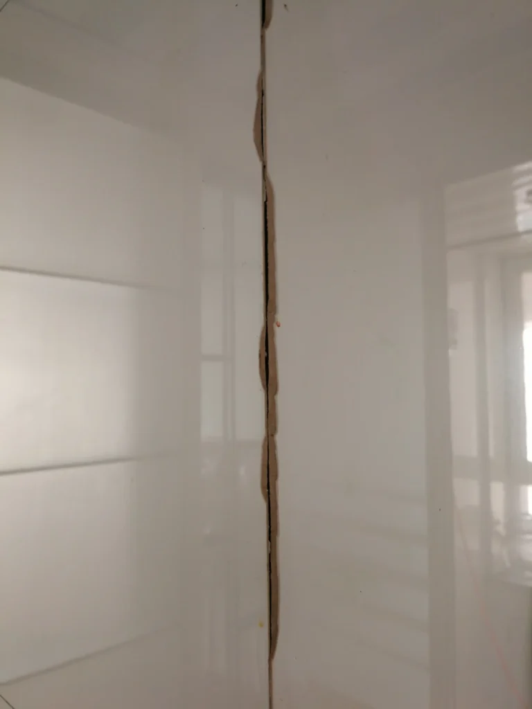 Butted tile no grout line corner chipping