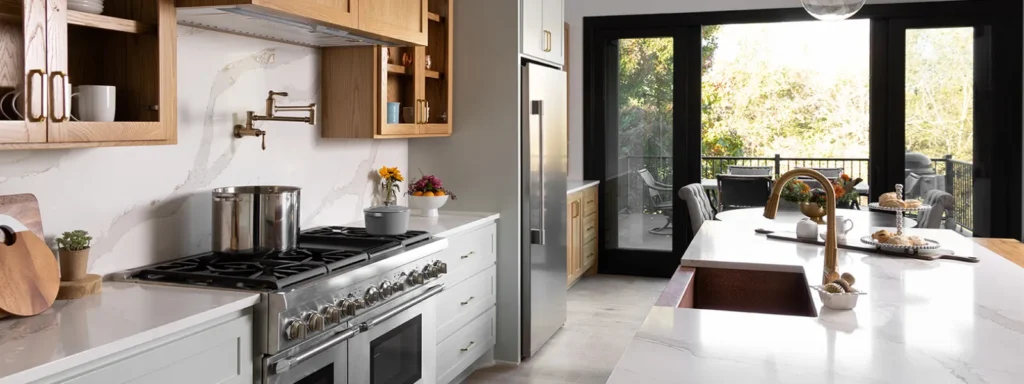 Full height granite slab backsplash integrated outlets