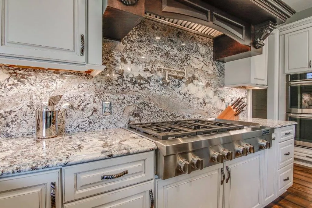 Full height stone backsplash kitchen ledge