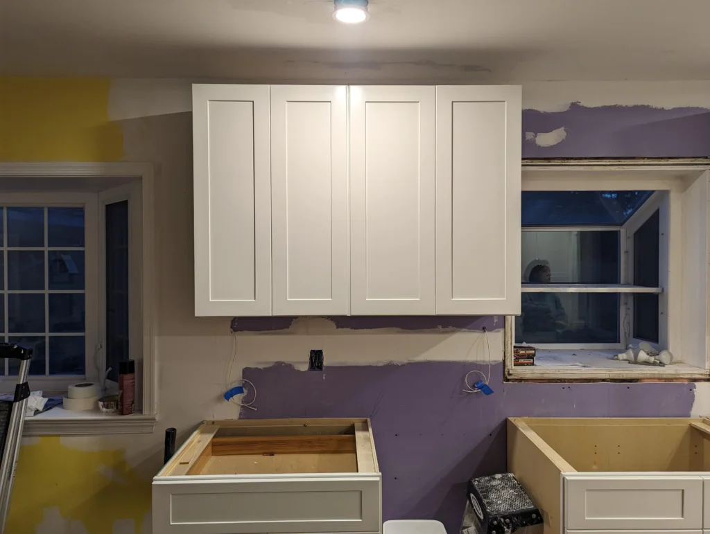 Install uppers before base cabinets