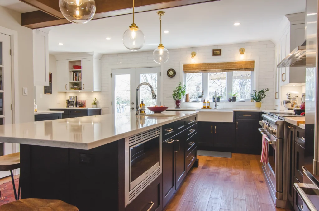 Light wood floor with black kitchen cabinets rug