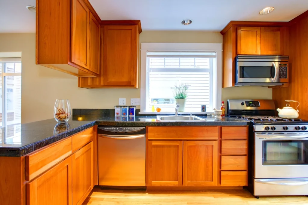 Tone down orange hickory cabinets lighting paint choices