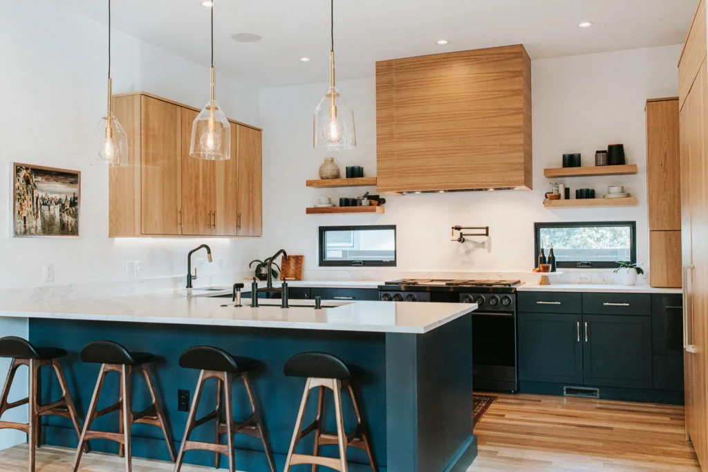 Two tone kitchen hickory island white uppers light countertop