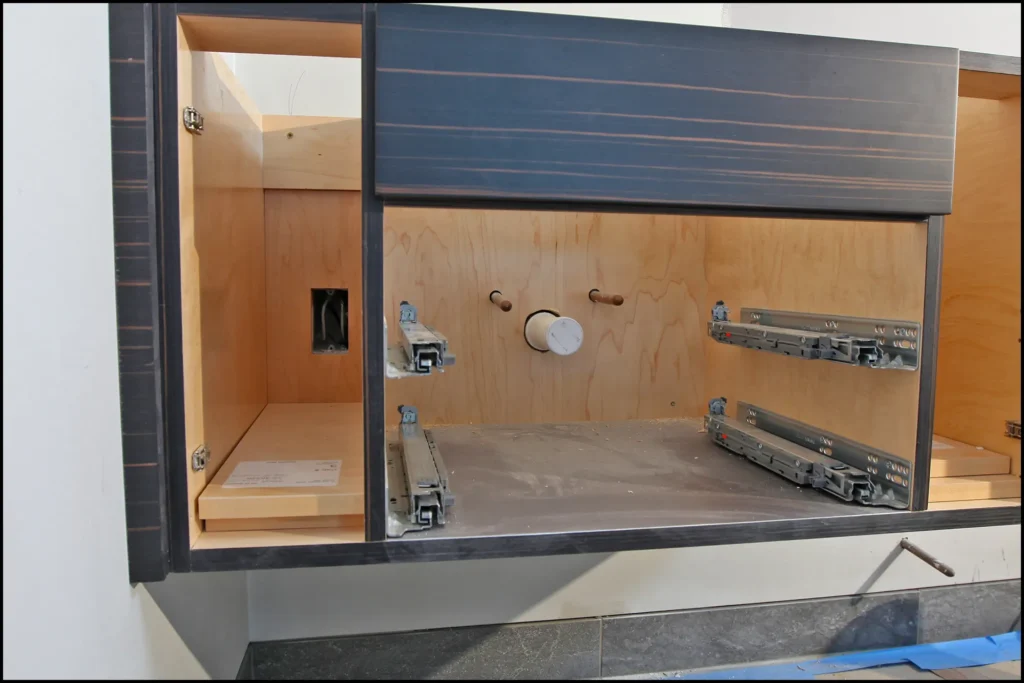 Cutout plumbing behind cabinet vanity