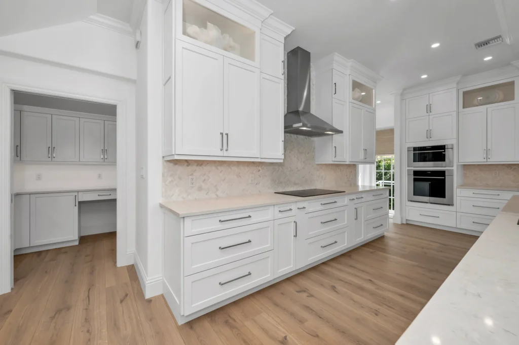 Install hardwood floor under kitchen cabinets