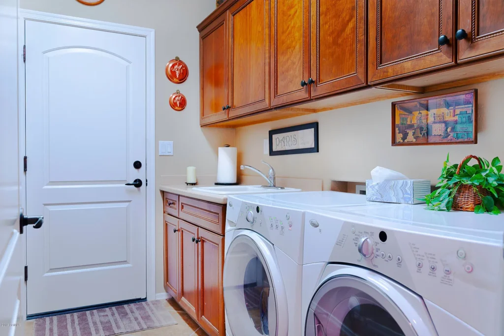 Laundry room layout plan washer dryer cabinet sizes outlets vent diagram