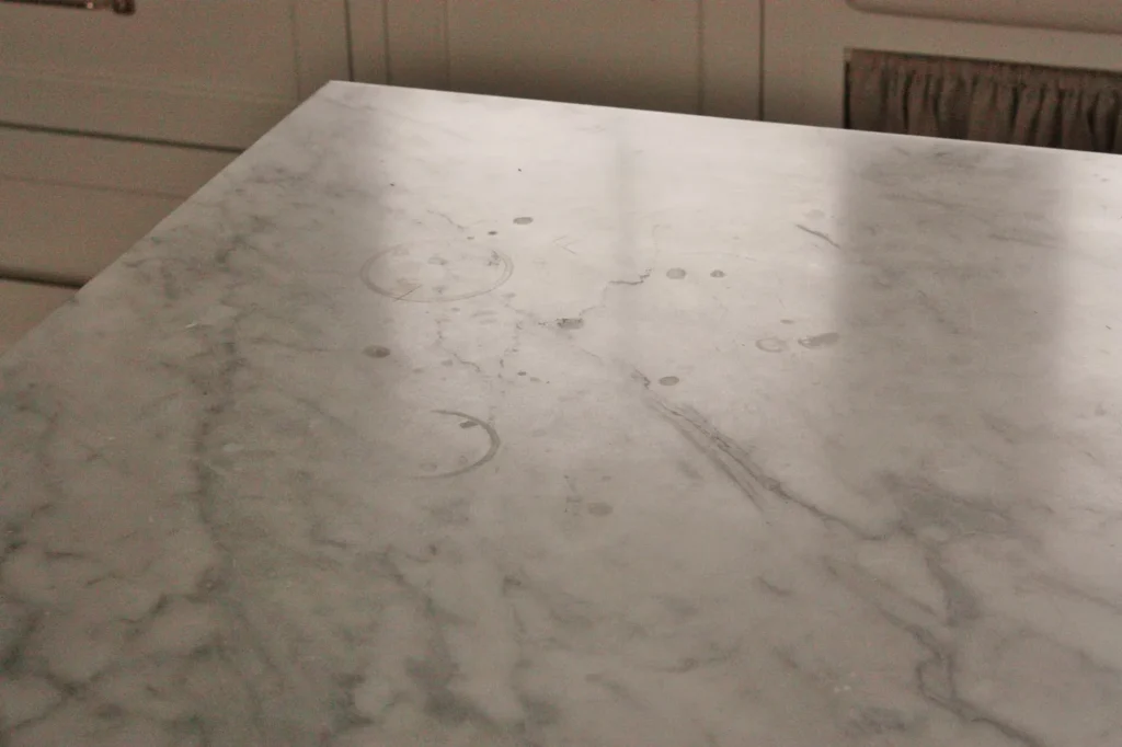 Marble etch mark vs stain ring low angle light