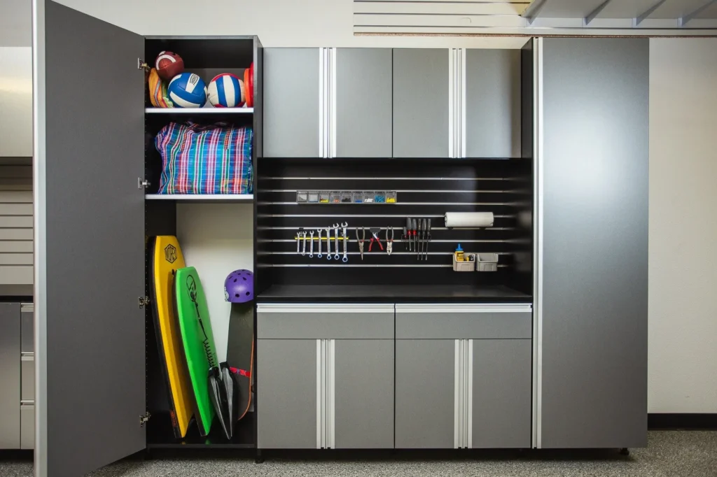 Custom garage cabinets with tool wall tall storage and sports gear area