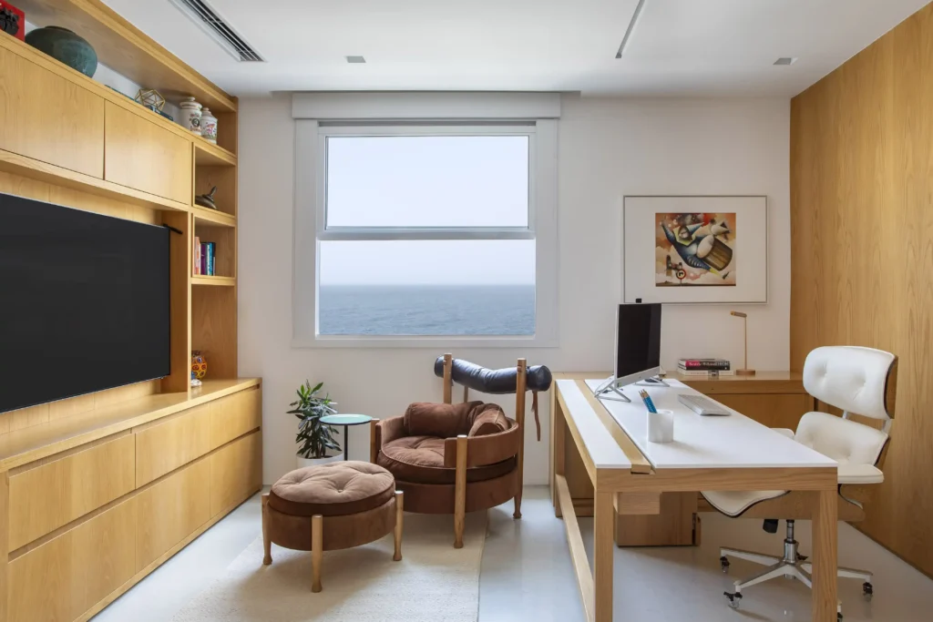 Home office that can convert to guest room with wall to wall cabinets