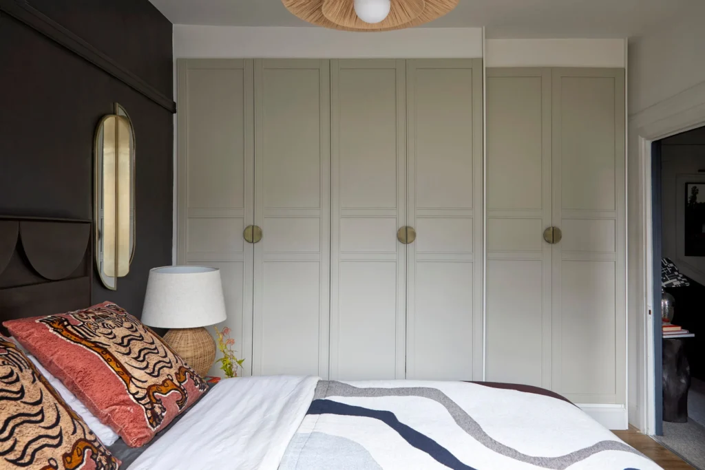 Hotel style bedroom with bed nightstands and built in wardrobe