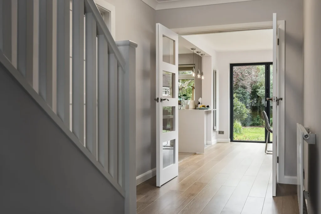 Modern hallway with solid wood doors and coordinated flooring