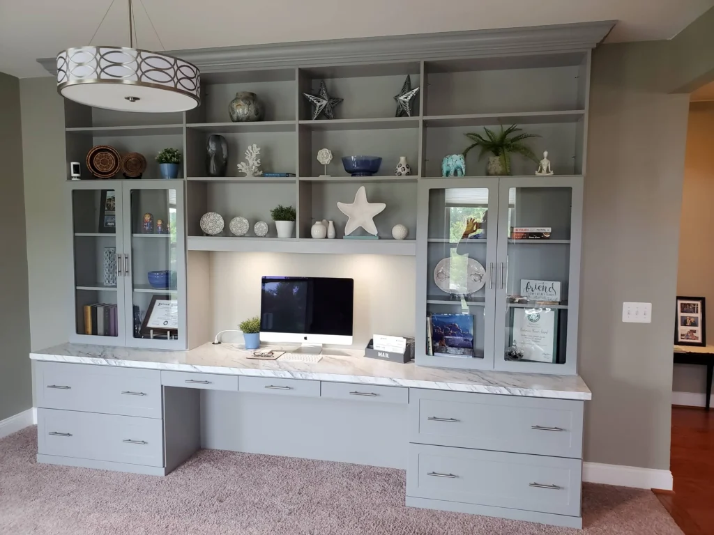 Modern home office with built in custom cabinets and large desk