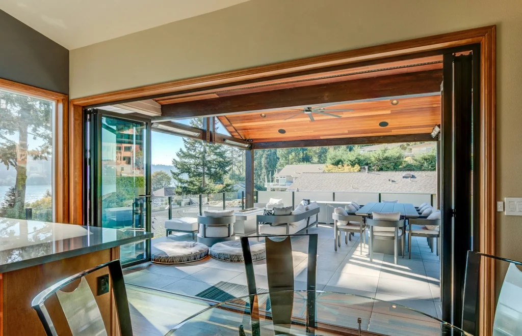 Villa living room with large Folding Doors opening to a terrace